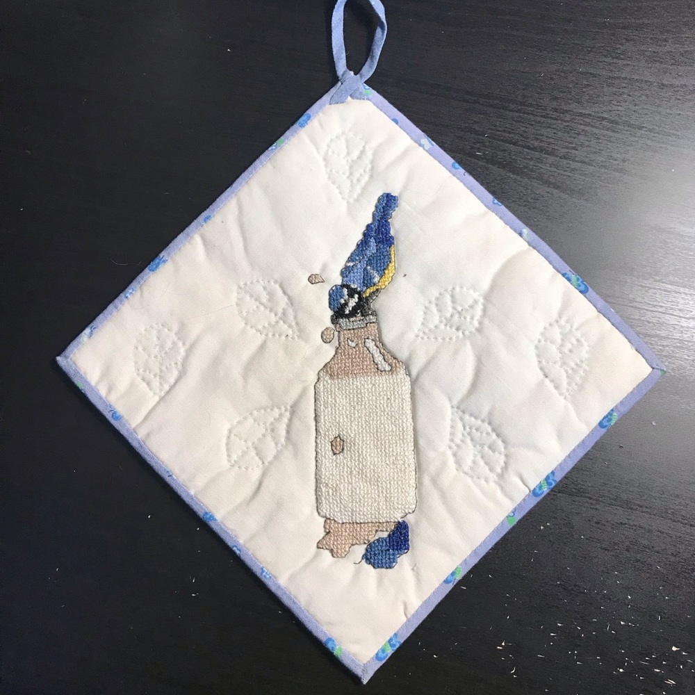 Handmade cross stitch hot pad, blue bird on milk bottle